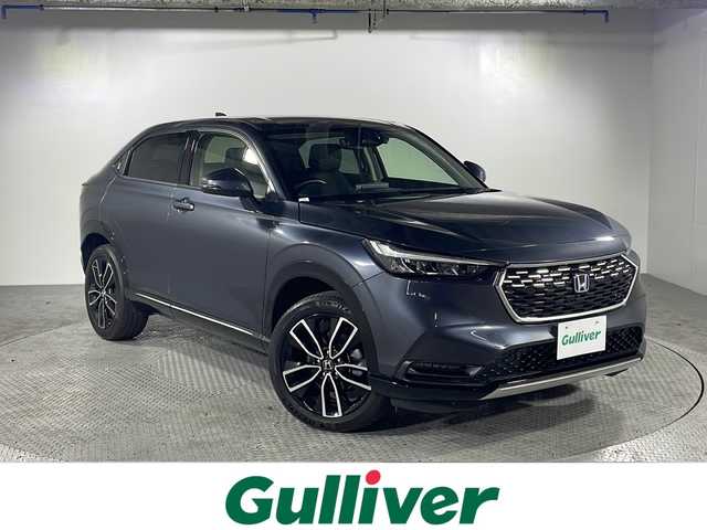 ホンダ ヴェゼル ハイブリッド e:HEV Z 沖縄県 2021(令3)年 4.1万km メテオロイドグレーメタリック 県外仕入/禁煙車/純正９インチナビ/   フルセグTV/Bluetooth/USB/バックモニター/衝突軽減ブレーキ/横滑り防止装置/コーナーセンサー/ＢＳＭ/前席シートヒーター/レーダークルーズコントロール/レーンキープアシスト/アイドリングストップ/パドルシフト/ワイヤレス充電/前後ドライブレコーダー/オートマチックハイビーム/純正18インチアルミホイール/純正フロアマット/プッシュスタート/スマートキー/ハーフレザーシート/ＥＴＣ/ＬＥＤ