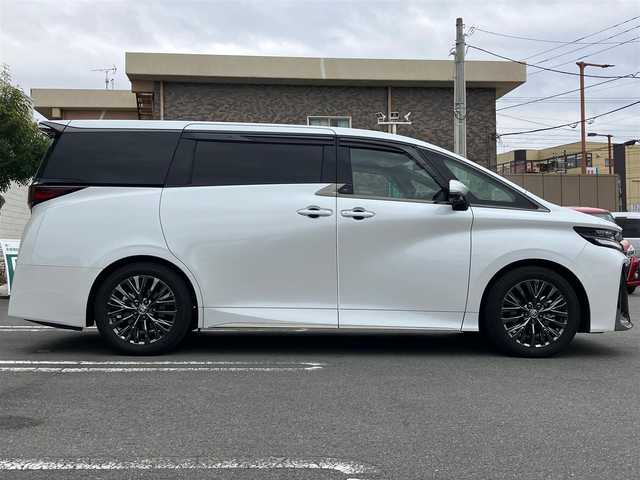 トヨタ ヴェルファイア ハイブリット Z プレミア 静岡県 2024(令6)年 0.6万km プラチナホワイトパールマイカ セキュリティーArgus/デジタルインナーミラー/エンジンスタートボタン/スマートキー（スペアキー１本）/パワーウィンドウ/パワーステアリング/MTモード付AT/100V充電/Wオートエアコン/クルーズコントロール/ETC2.0/USB入力端子/全方位カメラ/純正メーカーナビ（BT.フルセグ）/３列シート/ガラスルーフ/オットマン/電動リアゲート/ドライブレコーダー前後/ウォークスルー/フロアマット/D席N席パワーシート/D席N席セカンドシートシートヒーター/D席N席セカンドシートエアシート/両側パワースライドドア/純正アルミホイール/ABS/横滑り防止装置/コーナーセンサー前後/レーンキープアシスト/盗難防止装置/オートライト/オートマチックハイビーム/LEDライト/W+サイドエアバック/衝突軽減システム/ステアリングヒーター