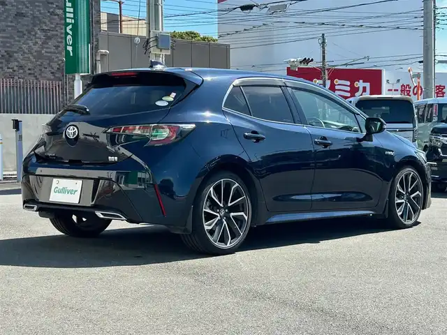 トヨタ カローラ スポーツ ハイブリッドG Z 静岡県 2019(令1)年 3.4万km ブラッキッシュアゲハガラスフレーク エンジンスタートボタン/パワーステアリング/パワーウィンドウ/アイドリングストップ/スマートキー/オートエアコン/クルーズコントロール/USB入力端子/ETC/純正ナビ/純正ドライブレコーダー/純正フロアマット/純正アルミホイール/ABS/横滑り防止装置/コーナーセンサー前後/レーンキープアシスト/盗難防止装置/オートライト/オートマチックハイビーム/LEDヘッドライト/W+サイドエアバック/カーテンエアバック/衝突軽減システム