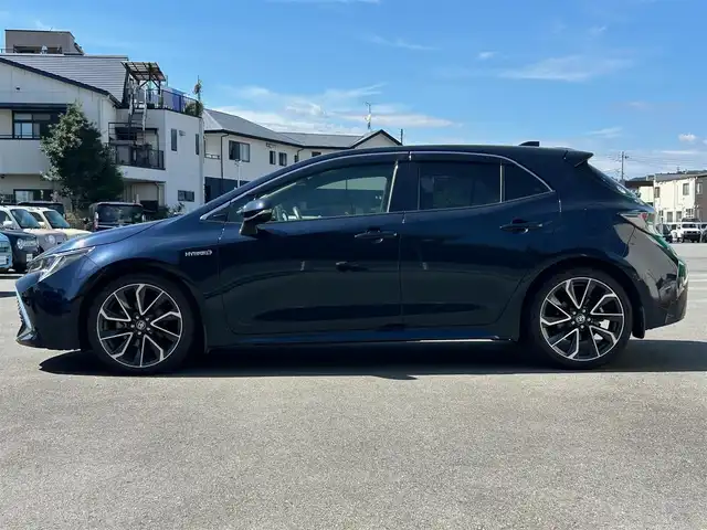トヨタ カローラ スポーツ ハイブリッドG Z 静岡県 2019(令1)年 3.4万km ブラッキッシュアゲハガラスフレーク エンジンスタートボタン/パワーステアリング/パワーウィンドウ/アイドリングストップ/スマートキー/オートエアコン/クルーズコントロール/USB入力端子/ETC/純正ナビ/純正ドライブレコーダー/純正フロアマット/純正アルミホイール/ABS/横滑り防止装置/コーナーセンサー前後/レーンキープアシスト/盗難防止装置/オートライト/オートマチックハイビーム/LEDヘッドライト/W+サイドエアバック/カーテンエアバック/衝突軽減システム