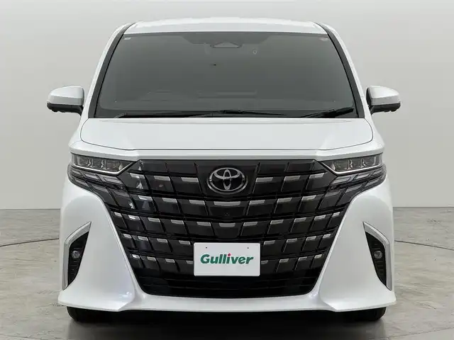 トヨタ アルファードハイブリット Z 福岡県 2024(令6)年 1.5万km プラチナホワイトパールマイカ 純正１４型ＤＡナビ／全方位カメラ　/ワイヤレス充電　/デジタルルームミラー　/ビルトインETC２．０　/前後ドライブレコーダー　/トヨタセーフティセンス　/レーダークルーズコントロール　/コーナーセンサー　/衝突軽減ブレーキ　/レーンキープ　/ブラインドスポットモニター　/アクセル踏み間違い防止　/両側電動スライドドア　/パワーバックドア　/シートベンチレーション／ヒーター　/ステアリングヒーター　/シートメモリー付きパワーシート　/３眼ＬＥＤ