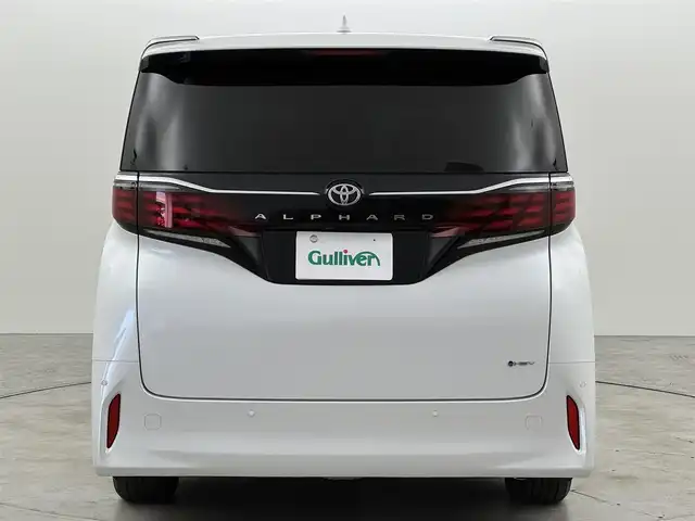 トヨタ アルファードハイブリット Z 福岡県 2024(令6)年 1.5万km プラチナホワイトパールマイカ 純正１４型ＤＡナビ／全方位カメラ　/ワイヤレス充電　/デジタルルームミラー　/ビルトインETC２．０　/前後ドライブレコーダー　/トヨタセーフティセンス　/レーダークルーズコントロール　/コーナーセンサー　/衝突軽減ブレーキ　/レーンキープ　/ブラインドスポットモニター　/アクセル踏み間違い防止　/両側電動スライドドア　/パワーバックドア　/シートベンチレーション／ヒーター　/ステアリングヒーター　/シートメモリー付きパワーシート　/３眼ＬＥＤ