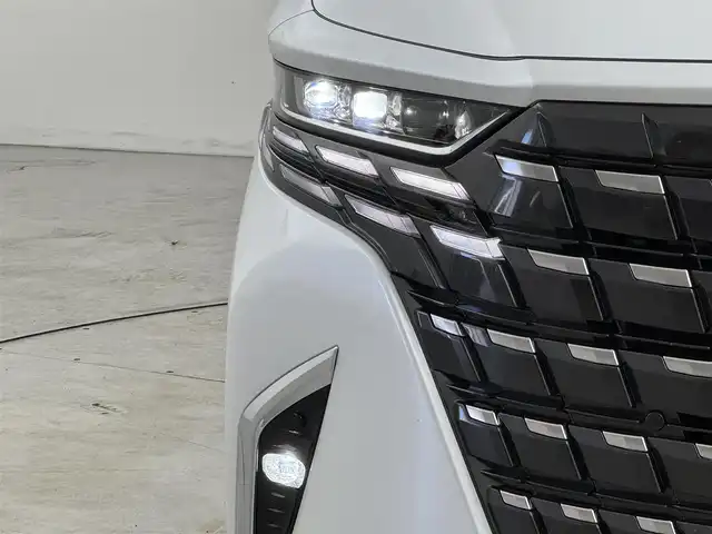 トヨタ アルファードハイブリット Z 福岡県 2024(令6)年 1.5万km プラチナホワイトパールマイカ 純正１４型ＤＡナビ／全方位カメラ　/ワイヤレス充電　/デジタルルームミラー　/ビルトインETC２．０　/前後ドライブレコーダー　/トヨタセーフティセンス　/レーダークルーズコントロール　/コーナーセンサー　/衝突軽減ブレーキ　/レーンキープ　/ブラインドスポットモニター　/アクセル踏み間違い防止　/両側電動スライドドア　/パワーバックドア　/シートベンチレーション／ヒーター　/ステアリングヒーター　/シートメモリー付きパワーシート　/３眼ＬＥＤ