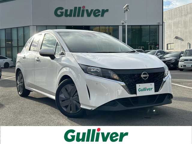 日産 ノート X 愛媛県 2022(令4)年 8万km ホワイト 禁煙車/登録時走行距離：79517km/ETC2.0/メーカーオプション純正ナビ/BT/AM・FM/HDMI/フルセグ/ワイヤレス充電/インテリジェントクルーズコントロール/プロパイロット/ブラインドスポットモニター/オートホールド