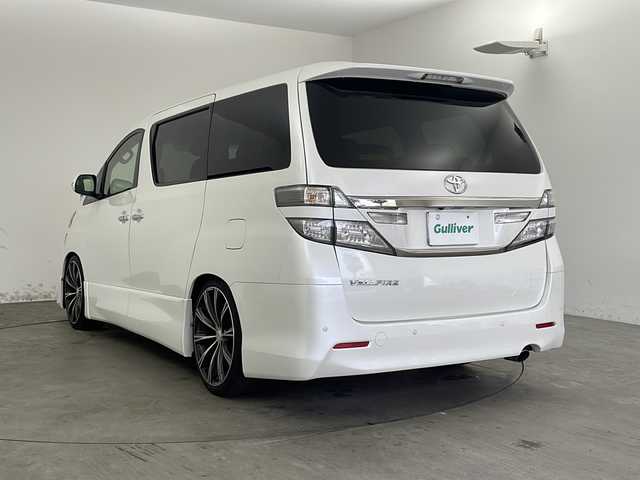 トヨタ ヴェルファイア 2．4Z Gエディション 兵庫県 2012(平24)年 5万km ホワイトパールクリスタルシャイン ・純正ナビ（TV・CD・DVD・MSV・BT）/・バックカメラ/・両側パワースライドドア/・パワーバックドア/・2列目エグゼクティブシート/・ビルトインETC/・クルーズコントロール/・純正リアフリップダウンモニター/・プレミアムサウンド/・コーナーセンサー/・フットイルミネーション/・nanoe/・AC100V電源/・純正ウッドコンビステアリング/・社外革調シートカバー/・オットマン/・前席パワーシート/・社外20インチアルミホイール/・HIDオートライト/・LEDフォグランプ/・社外車高調/・スマートキー/・スペアキー/・プッシュスタート/・社外フロアマット/・横滑り防止装置