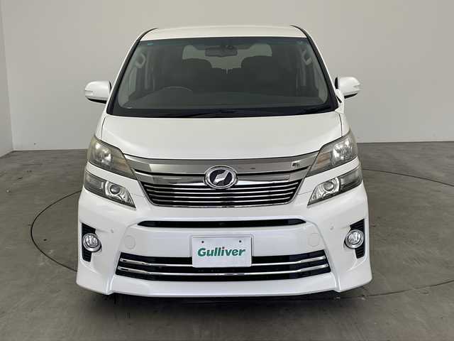 トヨタ ヴェルファイア 2．4Z Gエディション 兵庫県 2012(平24)年 5万km ホワイトパールクリスタルシャイン ・純正ナビ（TV・CD・DVD・MSV・BT）/・バックカメラ/・両側パワースライドドア/・パワーバックドア/・2列目エグゼクティブシート/・ビルトインETC/・クルーズコントロール/・純正リアフリップダウンモニター/・プレミアムサウンド/・コーナーセンサー/・フットイルミネーション/・nanoe/・AC100V電源/・純正ウッドコンビステアリング/・社外革調シートカバー/・オットマン/・前席パワーシート/・社外20インチアルミホイール/・HIDオートライト/・LEDフォグランプ/・社外車高調/・スマートキー/・スペアキー/・プッシュスタート/・社外フロアマット/・横滑り防止装置
