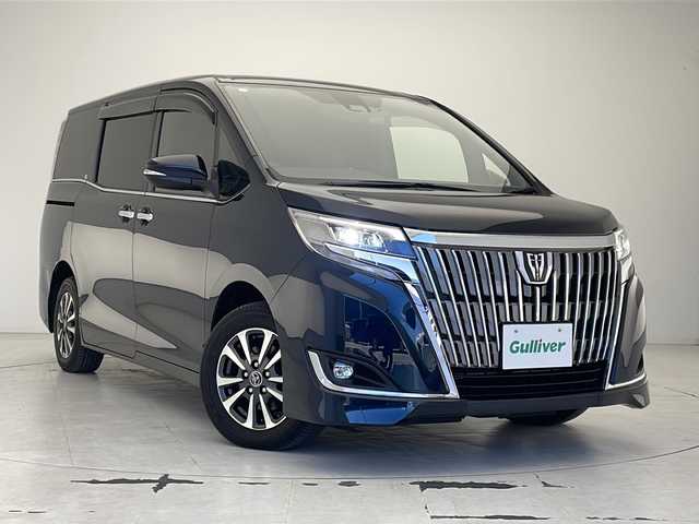 トヨタ エスクァイア Gi 沖縄県 2017(平29)年 5.8万km ブラッキッシュアゲハガラスフレーク 純正９インチナビ(NSZT-Y66T)/（フルセグＴＶ　DVD　Ｂｌｕｅｔｏｏｔｈ）/純正12.1インチフリップダウンモニター/バックカメラ/ＥＴＣ/前後ドライブレコーダー/両側パワースライドドア/レザーシート/シートヒーター/トヨタセーフティセンス/・衝突被害軽減ブレーキ (プリクラッシュセーフティ)																									/・ハンドル操作サポート (レーントレーシングアシスト)																																																		/・車線はみ出しアラート (レーンディパーチャーアラート)																									/・自動ハイビーム (オートマチックハイビーム)	/クルーズコントロール																								/ステアリングスイッチ/ウッドコンビ革巻きステアリング/純正フロアマット/純正15インチアルミホイール/アイドリングストップ/保証書