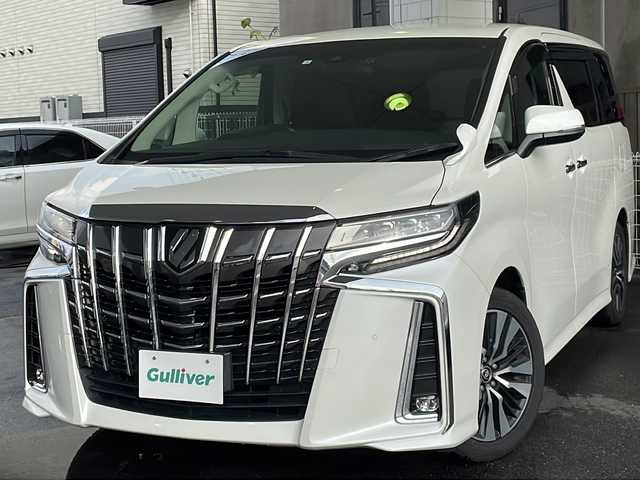 トヨタ アルファード S Cパッケージ 京都府 2020(令2)年 10.2万km ホワイトパールクリスタルシャイン 純正ＳＤナビ　/フルセグＴＶ/テレビキャンセラー　/Bluetooth/Miracast/CD/DVD再生機能有/USB/トヨタセーフティセンス　/禁煙車　/バックカメラ/フリップダウンモニター/（V12T-R68C)　/デジタルインナーミラー　/ウィンカーミラー/電動格納ミラー　/前後コーナーセンサー　/ＢＳＭ　/３眼ＬＥＤ　/オートライト/オートマチックハイビーム/クルコン追従有　/ポジションメモリー/前席＋2列目パワーシート/前席シートヒーター/エアシート/ハンドルヒーター/デュアルエアコン/オットマン/ウォークスルー/サンシェード/ETC/横滑り防止装置/レーンキープアシスト/盗難防止装置/Wサイドエアバッグ/カーテンエアバッグ