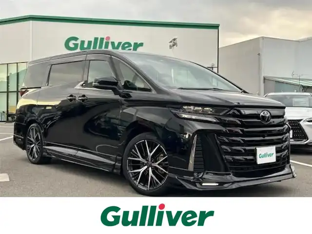 トヨタ ヴェルファイア ハイブリット Z プレミア 愛媛県 2023(令5)年 3.9万km ブラック ムーンルーフ/ワンオーナー/純正14型ナビ/フルセグTV/両側パワースライドドア/パワーバックドア/パノラミックビューモニター/ビルトインETC2.0/ドライブレコーダー/後席用フリップダウンモニター/駐車支援システム/レーダークルーズコントロール/コーナーセンサー/衝突被害軽減ブレーキ/車線逸脱防止支援システム/車線変更支援/ブラインドスポットモニター/デジタルインナーミラー/LEDヘッドランプ/デュアルオートエアコン/木目調/革巻きコンビステアリング/ステアリングヒーター/ナッパ革シート/前席/2列目シートヒーター/前席パワーシート/2列目エグゼクティブパワーシート/運転席ポジションメモリー/GRエアロ/マフラー/社外20インチアルミホイール/スマートキー/プッシュエンジンスタート/禁煙車