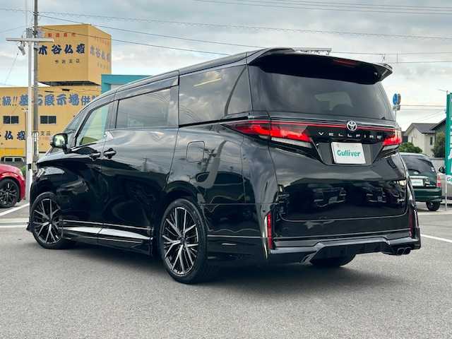 トヨタ ヴェルファイア ハイブリット Z プレミア 愛媛県 2023(令5)年 3.9万km ブラック ムーンルーフ/ワンオーナー/純正14型ナビ/フルセグTV/両側パワースライドドア/パワーバックドア/パノラミックビューモニター/ビルトインETC2.0/ドライブレコーダー/後席用フリップダウンモニター/駐車支援システム/レーダークルーズコントロール/コーナーセンサー/衝突被害軽減ブレーキ/車線逸脱防止支援システム/車線変更支援/ブラインドスポットモニター/デジタルインナーミラー/LEDヘッドランプ/デュアルオートエアコン/木目調/革巻きコンビステアリング/ステアリングヒーター/ナッパ革シート/前席/2列目シートヒーター/前席パワーシート/2列目エグゼクティブパワーシート/運転席ポジションメモリー/GRエアロ/マフラー/社外20インチアルミホイール/スマートキー/プッシュエンジンスタート/禁煙車