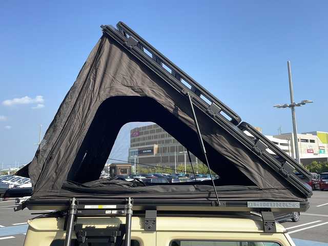 スズキ ジムニー シエラ JC 愛知県 2024(令6)年 0.3万km シフォンアイボリーM GI WORKSルーフトップテント/GI WORKSルーフラック/GI WORKSサイドオーニング/サイドステップ/スズキセフーフティサポート/衝突被害軽減ブレーキ/7インチディスプレイオーディオナビ（ナビ無し）/クルーズコントロール/シートヒーター/Bluetooth/バックカメラ/コーナーセンサー/純正アルミホイール/4WD/LEDヘッドライト/ダウンヒルアシストコントロール/オートマチックハイビーム/ドライブレコーダー/ステアリングスイッチ/スマートキー/プッシュスタート