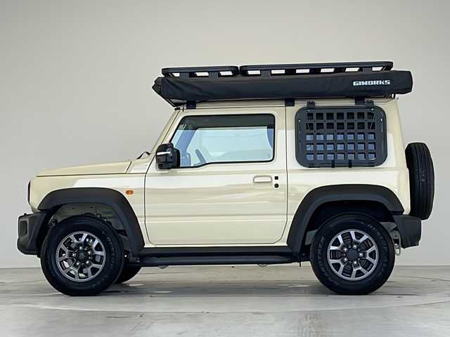 スズキ ジムニー シエラ JC 愛知県 2024(令6)年 0.3万km シフォンアイボリーM GI WORKSルーフトップテント/GI WORKSルーフラック/GI WORKSサイドオーニング/サイドステップ/スズキセフーフティサポート/衝突被害軽減ブレーキ/7インチディスプレイオーディオナビ（ナビ無し）/クルーズコントロール/シートヒーター/Bluetooth/バックカメラ/コーナーセンサー/純正アルミホイール/4WD/LEDヘッドライト/ダウンヒルアシストコントロール/オートマチックハイビーム/ドライブレコーダー/ステアリングスイッチ/スマートキー/プッシュスタート