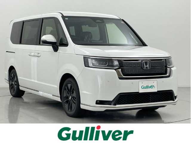 ホンダ ステップワゴン スパーダ eHEV 熊本県 2025(令7)年 0.1千km プラチナホワイトパール 登録済未使用車/純正１１．４インチディスプレイオーディオ LXM-247VFLi　バックカメラ　/両側パワースライドドア　/前後クリアランスソナー　/ホンダセンシング/・レーダークルーズコントロール/・衝突軽減ブレーキ/・誤発進制御機能/・歩行者事故低減ステアリング/・路外逸脱抑制機能/・先行車発進お知らせ機能/・標識認識システム/・ブラインドスポットモニター/横滑り防止/パワーバックドア/前席シートヒーター/オットマン/ハーフレザーシート/純正16インチAW/オートライト/LEDヘッドライト/フォグランプ/スマートキー/プッシュスタート/スペアキー1本/保証書/取扱説明書　
