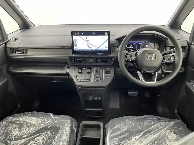 ホンダ ステップワゴン スパーダ eHEV 熊本県 2025(令7)年 0.1千km プラチナホワイトパール 登録済未使用車/純正１１．４インチディスプレイオーディオ LXM-247VFLi　バックカメラ　/両側パワースライドドア　/前後クリアランスソナー　/ホンダセンシング/・レーダークルーズコントロール/・衝突軽減ブレーキ/・誤発進制御機能/・歩行者事故低減ステアリング/・路外逸脱抑制機能/・先行車発進お知らせ機能/・標識認識システム/・ブラインドスポットモニター/横滑り防止/パワーバックドア/前席シートヒーター/オットマン/ハーフレザーシート/純正16インチAW/オートライト/LEDヘッドライト/フォグランプ/スマートキー/プッシュスタート/スペアキー1本/保証書/取扱説明書　