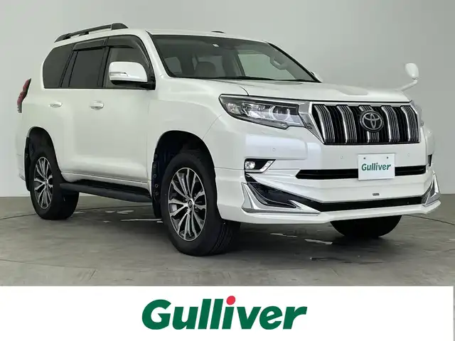 トヨタ ランドクルーザー プラド TX Lパッケージ 大分県 2020(令2)年 4.6万km ホワイトパールクリスタルシャイン 純正９インチナビ/フルセグ/DVD/Bluetooth/プリクラッシュセーフティー/サンルーフ/モデリスタエアロ/バックモニター/エアシートヒーター/レーダークルーズコントロール/前席パワーシート/ルーフレール/純正フロアマット/ＥＴＣ/オートＬＥＤライト/スマートキーX2
