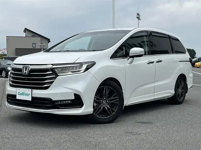 ホンダ オデッセイ ハイブリッド e:HEVアブソルート EX 奈良県 2022(令4)年 3.1万km プラチナホワイトパール 純正10インチメーカーナビ(VXU-227DYi)/(AM/FM/CD/DVD/BT/SD?USB/iPod/フルセグTV）/全方位モニター/ビルトインETC2.0/ハーフレザーシート/パワーシート/シートヒーター/シートベンチレーション/パワーバックドア/両側パワースライドドア/ドライブレコーダー/レーダークルーズコントロール/衝突軽減ブレーキ/レーントレーシングアシスト/横滑り防止装置/オートライト/革巻きステアリング/ステアリングスイッチ/純正フロアマット/電格ウインカーミラー/スペアキー/電動サイドブレーキ