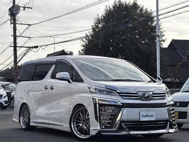 トヨタ ヴェルファイア Z Gエディション 熊本県 2018(平30)年 6.2万km ホワイトパールクリスタルシャイン モデリスタフルエアロ/DORFREN21インチAW/純正10インチナビ（NSZN-Z68T）/【フルセグTV/Bluetooth/CD/DVD】/バックカメラ/フリップダウンモニター/両側パワースライドドア/レーダークルーズコントロール/プリクラッシュセーフティー/レーントレーシングアシスト/クリアランスソナー/パーキングサポートブレーキ/ロードサインアシスト/デジタルインナーミラー/パワーバックドア/オートLEDヘッドライト/オートハイビーム/ウィンカーミラー/ブレーキホールド/1/2列目パワーシート/N席/2列目オットマン/前席シートヒーター/エアシート/ステアリングヒーター/ステアリングスイッチ/ドライブレコーダー前後/ビルトインETC/純正フロアマット/純正ドアバイザー/プッシュスタート/スマートキー/横滑り防止装置/保証書/スペアキー