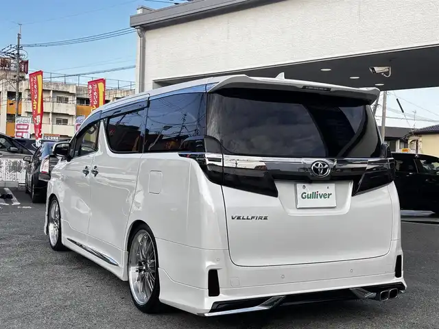 トヨタ ヴェルファイア Z Gエディション 熊本県 2018(平30)年 6.2万km ホワイトパールクリスタルシャイン モデリスタフルエアロ/DORFREN21インチAW/純正10インチナビ（NSZN-Z68T）/【フルセグTV/Bluetooth/CD/DVD】/バックカメラ/フリップダウンモニター/両側パワースライドドア/レーダークルーズコントロール/プリクラッシュセーフティー/レーントレーシングアシスト/クリアランスソナー/パーキングサポートブレーキ/ロードサインアシスト/デジタルインナーミラー/パワーバックドア/オートLEDヘッドライト/オートハイビーム/ウィンカーミラー/ブレーキホールド/1/2列目パワーシート/N席/2列目オットマン/前席シートヒーター/エアシート/ステアリングヒーター/ステアリングスイッチ/ドライブレコーダー前後/ビルトインETC/純正フロアマット/純正ドアバイザー/プッシュスタート/スマートキー/横滑り防止装置/保証書/スペアキー