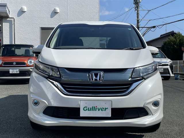 ホンダ フリード＋ ハイブリット EX 熊本県 2018(平30)年 6.8万km ホワイトオーキッドパール 純正9インチナビ（VXM-187VFNi）/【フルセグTV/Bluetooth再生/CD/DVD】/バックカメラ/両側パワースライドドア/アダプティブクルーズコントロール/車線維持支援システム/路外逸脱抑制システム/衝突軽減ブレーキ/LEDオートライト/フォグライト/ハーフレザーシート/ビルトインETC/ドライブレコーダー/保証書/取扱説明書