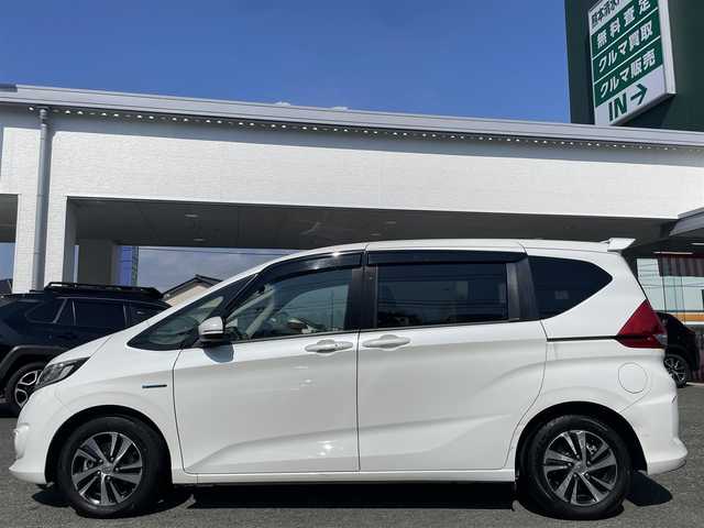 ホンダ フリード＋ ハイブリット EX 熊本県 2018(平30)年 6.8万km ホワイトオーキッドパール 純正9インチナビ（VXM-187VFNi）/【フルセグTV/Bluetooth再生/CD/DVD】/バックカメラ/両側パワースライドドア/アダプティブクルーズコントロール/車線維持支援システム/路外逸脱抑制システム/衝突軽減ブレーキ/LEDオートライト/フォグライト/ハーフレザーシート/ビルトインETC/ドライブレコーダー/保証書/取扱説明書