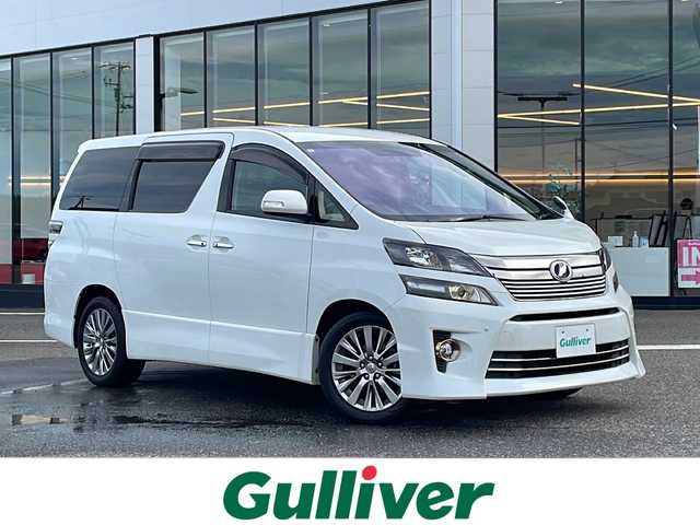 トヨタ ヴェルファイア 2．4Z ゴールデンアイズⅡ 新潟県 2013(平25)年 14.4万km ホワイトパールクリスタルシャイン ４WD/SDナビ/（DTV/DVD/Bluetooth）/フリップダウンモニター/バックカメラ/コーナーセンサー/クルーズコントロール/ETC/MTモード付AT/プッシュスタート/ハーフレザーシート/オットマン/両側パワースライドドア/パワーバックドア/フロアマット/社外LEDヘッドライト/フォグランプ/ウィンカーミラー/電格ミラー