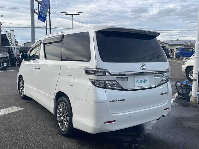トヨタ ヴェルファイア 2．4Z ゴールデンアイズⅡ 新潟県 2013(平25)年 14.4万km ホワイトパールクリスタルシャイン ４WD/SDナビ/（DTV/DVD/Bluetooth）/フリップダウンモニター/バックカメラ/コーナーセンサー/クルーズコントロール/ETC/MTモード付AT/プッシュスタート/ハーフレザーシート/オットマン/両側パワースライドドア/パワーバックドア/フロアマット/社外LEDヘッドライト/フォグランプ/ウィンカーミラー/電格ミラー