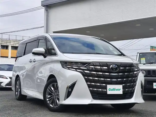 トヨタ アルファードハイブリット Z 熊本県 2023(令5)年 3.1万km プラチナホワイトパールマイカ ワンオーナー/左右独立ムーンルーフ/純正ディスプレイオーディオナビ/【フルセグTV/BT/HDMI】/全方位カメラ/純正フリップダウンモニター/デジタルインナーミラー/トヨタチームメイト/トヨタセーフティセンス/前後ドライブレコーダー/置くだけ充電/純正18インチAW/黒革シート/D/Nパワーシート（D席メモリ付）/D/Nシートヒーター/D/Nシートクーラー/後席シートヒーター/後席シートクーラー/ステアリングヒーター/パドルシフト/ビルトインETC2.0/スペアキー