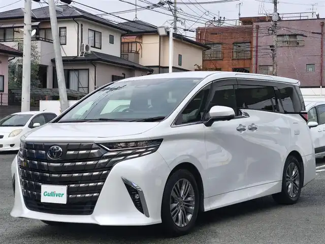 トヨタ アルファードハイブリット Z 熊本県 2023(令5)年 3.1万km プラチナホワイトパールマイカ ワンオーナー/左右独立ムーンルーフ/純正ディスプレイオーディオナビ/【フルセグTV/BT/HDMI】/全方位カメラ/純正フリップダウンモニター/デジタルインナーミラー/トヨタチームメイト/トヨタセーフティセンス/前後ドライブレコーダー/置くだけ充電/純正18インチAW/黒革シート/D/Nパワーシート（D席メモリ付）/D/Nシートヒーター/D/Nシートクーラー/後席シートヒーター/後席シートクーラー/ステアリングヒーター/パドルシフト/ビルトインETC2.0/スペアキー
