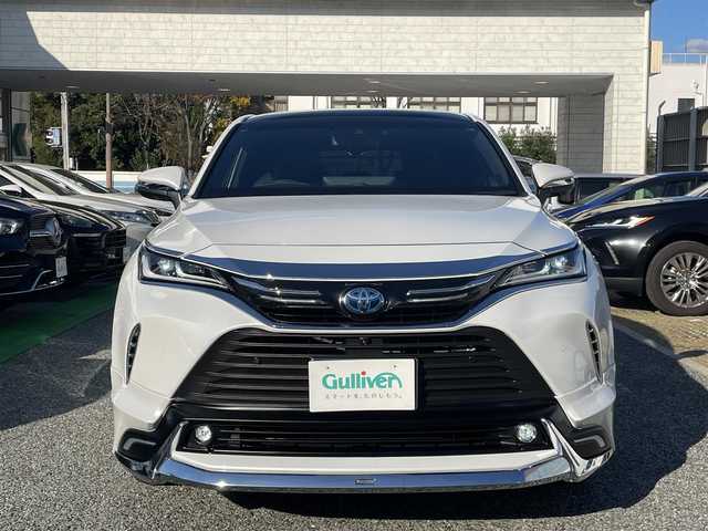 トヨタ ハリアー ハイブリッド Z レザーパッケージ 兵庫県 2024(令6)年 2.6万km プラチナホワイトパールマイカ /ワンオーナー/・OP 調光パノラマルーフ/・OP パノラミックビューモニター（床下透過表示機能）/・OP おくだけ充電/・MODELLISTAエアロパーツ（GRAN BLAZE STYLE）//フロントスポイラー（LED付）//サイドスカート//リヤスタイリングキット（リヤスカート/マフラーカッター）/・OP シグネチャーイルミグリル/・OPバックドアエアロプレート/・OP バックドアガーニッシュ/・OP 室内インテリアイルミネーション/・OP 3Dレザー調フロアマット/・OP GRスポーツサイドバイザー//ディスプレイオーディオ（コネクティッドナビ対応）Plus//12.3インチHDディスプレイ//TV/BT/USB/Miracast/Apple Car Play/HDMI//JBLサウンド//TVキャンセラー//デジタルインナーミラー（前後録画機能付）//ナノイーX//本革シート（ヒーター/ベンチレーション/電動）//ステアリングヒーター//オートLEDヘッドランプ//LEDフォグランプ//純正19インチAW//ハンズフリーパワーバックドア//カラーヘッドアップディスプレイ//PCS/LTA/BSM/RCTA/PKSB/RSA//先行車発進お知らせ/レーダークルーズコントロール//クリアランスソナー