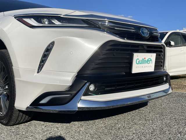 トヨタ ハリアー ハイブリッド Z レザーパッケージ 兵庫県 2024(令6)年 2.6万km プラチナホワイトパールマイカ /ワンオーナー/・OP 調光パノラマルーフ/・OP パノラミックビューモニター（床下透過表示機能）/・OP おくだけ充電/・MODELLISTAエアロパーツ（GRAN BLAZE STYLE）//フロントスポイラー（LED付）//サイドスカート//リヤスタイリングキット（リヤスカート/マフラーカッター）/・OP シグネチャーイルミグリル/・OPバックドアエアロプレート/・OP バックドアガーニッシュ/・OP 室内インテリアイルミネーション/・OP 3Dレザー調フロアマット/・OP GRスポーツサイドバイザー//ディスプレイオーディオ（コネクティッドナビ対応）Plus//12.3インチHDディスプレイ//TV/BT/USB/Miracast/Apple Car Play/HDMI//JBLサウンド//TVキャンセラー//デジタルインナーミラー（前後録画機能付）//ナノイーX//本革シート（ヒーター/ベンチレーション/電動）//ステアリングヒーター//オートLEDヘッドランプ//LEDフォグランプ//純正19インチAW//ハンズフリーパワーバックドア//カラーヘッドアップディスプレイ//PCS/LTA/BSM/RCTA/PKSB/RSA//先行車発進お知らせ/レーダークルーズコントロール//クリアランスソナー