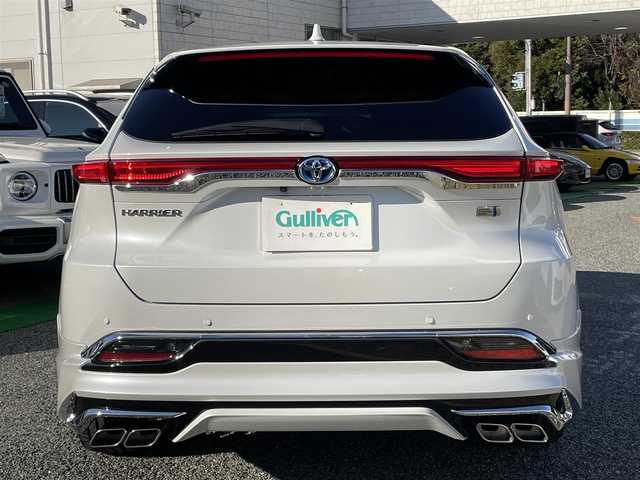 トヨタ ハリアー ハイブリッド Z レザーパッケージ 兵庫県 2024(令6)年 2.6万km プラチナホワイトパールマイカ /ワンオーナー/・OP 調光パノラマルーフ/・OP パノラミックビューモニター（床下透過表示機能）/・OP おくだけ充電/・MODELLISTAエアロパーツ（GRAN BLAZE STYLE）//フロントスポイラー（LED付）//サイドスカート//リヤスタイリングキット（リヤスカート/マフラーカッター）/・OP シグネチャーイルミグリル/・OPバックドアエアロプレート/・OP バックドアガーニッシュ/・OP 室内インテリアイルミネーション/・OP 3Dレザー調フロアマット/・OP GRスポーツサイドバイザー//ディスプレイオーディオ（コネクティッドナビ対応）Plus//12.3インチHDディスプレイ//TV/BT/USB/Miracast/Apple Car Play/HDMI//JBLサウンド//TVキャンセラー//デジタルインナーミラー（前後録画機能付）//ナノイーX//本革シート（ヒーター/ベンチレーション/電動）//ステアリングヒーター//オートLEDヘッドランプ//LEDフォグランプ//純正19インチAW//ハンズフリーパワーバックドア//カラーヘッドアップディスプレイ//PCS/LTA/BSM/RCTA/PKSB/RSA//先行車発進お知らせ/レーダークルーズコントロール//クリアランスソナー