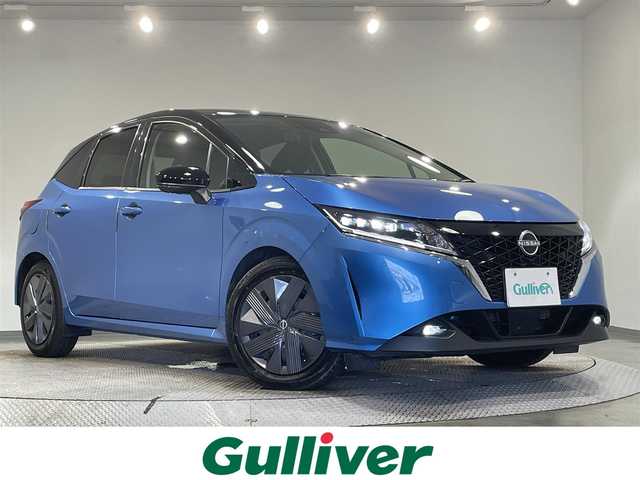 日産 ノート X 愛知県 2021(令3)年 2.7万km ビビットブルー / スーパーブラック 2トーン 純正９インチナビ/アラウンドビューモニター/衝突軽減ブレーキ/ブラインドスポットモニター/車線逸脱警報/クリアランスソナー/電動パーキングブレーキ/ワイヤレス充電/デジタルインナーミラー/ドライブレコーダー/ビルトインＥＴＣ２．０/USB＆HDMI入力端子/ＬＥＤヘッドライト/ISOFIX/純正フロアマット