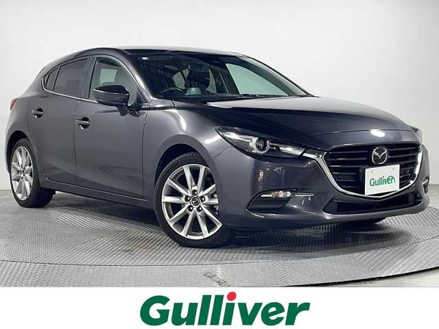 マツダ アクセラ スポーツ 15XD プロアクティブ 広島県 2016(平28)年 4.2万km マシーングレープレミアムM 純正ナビ/シートヒーター/パワーシート/ブラインドスポットモニター/レーダークルーズコントロール/ヘッドアップディスプレイ/ステアリングヒーター/オートマチックハイビーム/パドルシフト/ＥＴＣ/ＬＥＤヘッドライト/純正18インチアルミホイール(215/45/R18)/エアバッグ(運転席/助手席/サイド/カーテン)