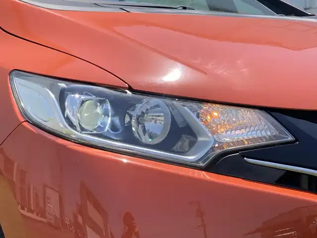 ホンダ フィット RS 香川県 2014(平26)年 12.4万km サンセットオレンジⅡ 登録時走行距離：123166km/ディーラー純正8型ナビ/　CD DVD BT フルセグTV/バックカメラ/シティブレーキアシスト/クルーズコントロール/パドルシフト/LEDヘッドライト/オートライト/フォグランプ/アイドリングストップ/横滑り防止装置/ETC/革巻きステアリング/ステアリングスイッチ/プッシュスタート/スマートキー/スペアキー