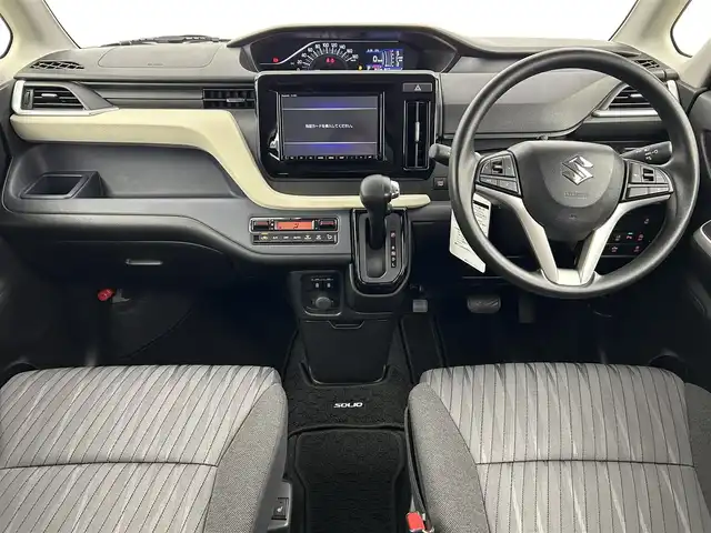 スズキ ソリオ HV MX 千葉県 2021(令3)年 0.9万km ピュアホワイトP 禁煙車/社外ナビ/・CN-RZ865/・CD/DVD/BT/フルセグ/左側パワースライドドア/デュアルカメラブレーキサポート/コーナーセンサー/前席シートヒーター/レーダークルーズコントロール/車線逸脱警報/ETC/純正15インチアルミホイール/スマートキー/スペアキー/横滑り防止装置/サイド＆カーテンエアバッグ