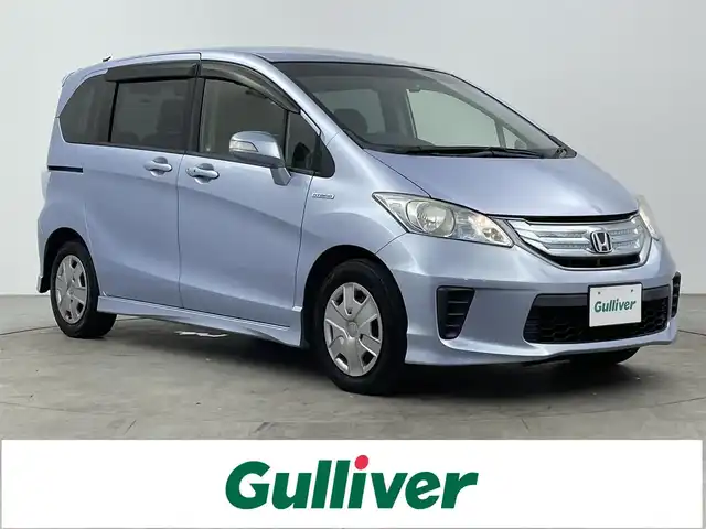 ホンダ フリード ハイブリット ジャストセレクション 大分県 2013(平25)年 8万km プレミアムブルーオパールメタリック 社外メモリーナビ/（フルセグ/CD/DVD/Bluetooth）/バックカメラ/両側パワースライドドア/HIDヘッドライト/クルーズコントロール/前後ドライブレコーダー/ステアリングスイッチ/オートエアコン/ビルトインETC/電動格納ミラー/保証書・取扱説明書/スマートキー