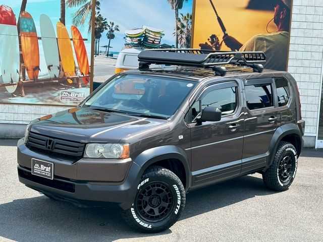 ホンダ クロスロード 18L HDDナビエディション 宮崎県 2009(平21)年 7.9万km 茶 AIS検査済み/【2501048980】社外パーツ取付有/全塗装（グラファイトメタリック）/純正HDDナビ/バックカメラ/HIDヘッドライト/キーレスキー/純正フロアマット/クリアサイドマーカー（社外）/WEDS　マッドヴァンスX タイプS（社外）/モンスタ　テレーングリッパー（社外）/リフトアップキット（社外）/アルミ製ルーフラック（社外）/イノー　ベースキャリア（社外）