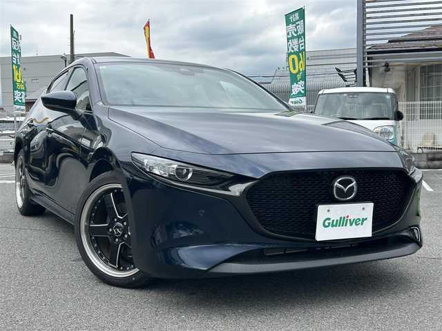 マツダ マツダ３ファストバック 15S ツーリング 奈良県 2019(令1)年 1.6万km ディープクリスタルブルーマイカ ワンオーナー/純正SDナビ8.8インチ/（フルセグ/BT/CD/DVD）/全方位カメラ/プリクラッシュセーフティー/BSM/横滑り防止システム/ヘッドアップディスプレイ/レーダーモニター/クルーズコントロール/（追従有）/前後コーナーセンサー/社外ホイール/（VALENTINA）/ETC/保証書/取扱説明書/スペアキー　有
