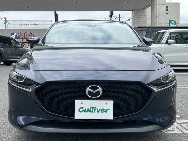 マツダ マツダ３ファストバック 15S ツーリング 奈良県 2019(令1)年 1.6万km ディープクリスタルブルーマイカ ワンオーナー/純正SDナビ8.8インチ/（フルセグ/BT/CD/DVD）/全方位カメラ/プリクラッシュセーフティー/BSM/横滑り防止システム/ヘッドアップディスプレイ/レーダーモニター/クルーズコントロール/（追従有）/前後コーナーセンサー/社外ホイール/（VALENTINA）/ETC/保証書/取扱説明書/スペアキー　有
