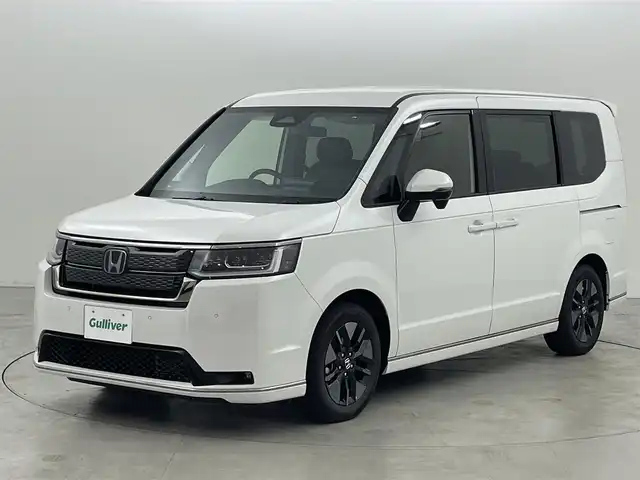 ホンダ ステップワゴン スパーダ eHEV 福岡県 2025(令7)年 0.1千km プラチナムホワイトパール 登録済未使用車　/純正１１．４型ナビ/フルセグTV　/バックカメラ　/アダプティブクルーズコントロール　/コーナーセンサー　/衝突軽減ブレーキ　/レーンキープ　/ブラインドスポットモニター　/アクセル踏み間違い防止　/パドルシフト　/両側電動スライドドア　/パワーバックドア　/ハーフレザーシート　/シートヒーター　/Wエアコン　/純正１６インチアルミホイール