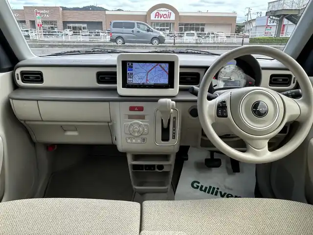 スズキ ラパン L 香川県 2025(令7)年 0.5万km トラッドカーキメタリック 登録時走行距離：4976km/シートヒーター/社外ナビ（CN-RA06D）/→FM/AM/TV/Bluetooth/デュアルカメラブレーキサポート　/クリアランスソナー　/ステアリングリモコン　/オートライト　/純正フロアマット　/アイドリングストップ　/横滑り防止防止　/レーンキープアシスト　/スマートキー　/スペアキー