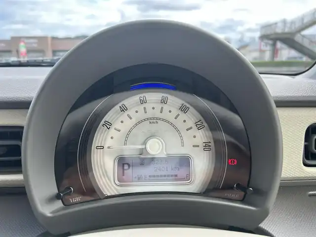 スズキ ラパン L 香川県 2025(令7)年 0.5万km トラッドカーキメタリック 登録時走行距離：4976km/シートヒーター/社外ナビ（CN-RA06D）/→FM/AM/TV/Bluetooth/デュアルカメラブレーキサポート　/クリアランスソナー　/ステアリングリモコン　/オートライト　/純正フロアマット　/アイドリングストップ　/横滑り防止防止　/レーンキープアシスト　/スマートキー　/スペアキー