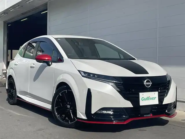 日産 オーラ ニスモ チューンド e－パワー 4WD 千葉県 2024(令6)年 1.1万km ピュアホワイトパール ワンオーナー/プロパイロット/全方位カメラ/前後コーナーセンサー/LEDヘッドライト/　・オートハイビーム/純正ナビ/　・フルセグTV/Blue Tooth/USB（タイプA・C両方）/HDMIケーブル/D席パワーシート/D/N席シートヒーター/前後ドライブレコーダー/パンク修理キット/ブレーキオートホールド/ビルトインETC2.0/取説/保証書/スペアキー