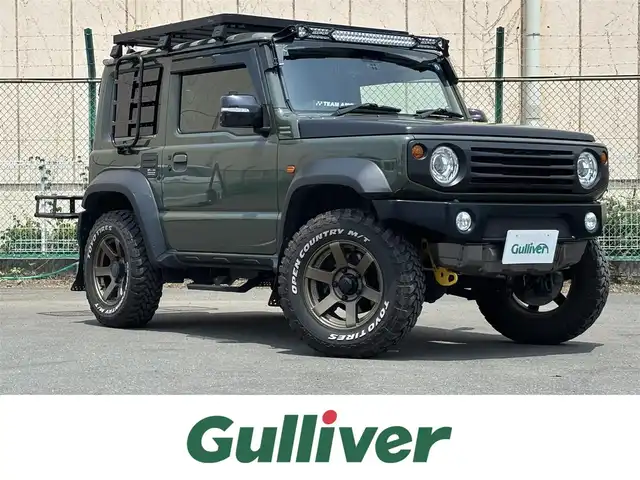 スズキ ジムニー シエラ JC 東京都 2020(令2)年 4.5万km ジャングルグリーン ４ＷＤ/セーフティサポート（予防安全技術）/アルパインナビ/バックカメラ/クルーズコントロール/ドライブレコーダー/ヒルディセントコントロール/LEDヘッドランプ/オートライト/ヘッドランプウォッシャー/ブラックドアミラー（電動オート格納機能/ヒーター/ウィンカー付）/ボディ同色アウトサイドドアハンドル/プライバシーガラス/アナログメーター/ホワイト照明マルチインフォメーションディスプレイ/革巻きステアリングホイール/ステアリングスイッチ/SRSエアバック  （運転席/助手席）/バニティミラー（運転席/助手席）/撥水加工ファブリックシート/シートヒーター（運転席/助手席）/キーレスプッシュスタートシステム/タクティカルＲバンパー/ナンバー移動キット/オーバーフェンダープロテクター/ヒッチキャリア/ルーフキャリア