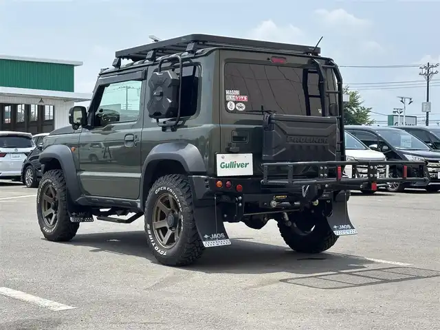 スズキ ジムニー シエラ JC 東京都 2020(令2)年 4.5万km ジャングルグリーン ４ＷＤ/セーフティサポート（予防安全技術）/アルパインナビ/バックカメラ/クルーズコントロール/ドライブレコーダー/ヒルディセントコントロール/LEDヘッドランプ/オートライト/ヘッドランプウォッシャー/ブラックドアミラー（電動オート格納機能/ヒーター/ウィンカー付）/ボディ同色アウトサイドドアハンドル/プライバシーガラス/アナログメーター/ホワイト照明マルチインフォメーションディスプレイ/革巻きステアリングホイール/ステアリングスイッチ/SRSエアバック  （運転席/助手席）/バニティミラー（運転席/助手席）/撥水加工ファブリックシート/シートヒーター（運転席/助手席）/キーレスプッシュスタートシステム/タクティカルＲバンパー/ナンバー移動キット/オーバーフェンダープロテクター/ヒッチキャリア/ルーフキャリア