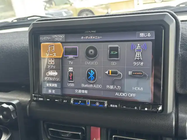 スズキ ジムニー シエラ JC 東京都 2020(令2)年 4.5万km ジャングルグリーン ４ＷＤ/セーフティサポート（予防安全技術）/アルパインナビ/バックカメラ/クルーズコントロール/ドライブレコーダー/ヒルディセントコントロール/LEDヘッドランプ/オートライト/ヘッドランプウォッシャー/ブラックドアミラー（電動オート格納機能/ヒーター/ウィンカー付）/ボディ同色アウトサイドドアハンドル/プライバシーガラス/アナログメーター/ホワイト照明マルチインフォメーションディスプレイ/革巻きステアリングホイール/ステアリングスイッチ/SRSエアバック  （運転席/助手席）/バニティミラー（運転席/助手席）/撥水加工ファブリックシート/シートヒーター（運転席/助手席）/キーレスプッシュスタートシステム/タクティカルＲバンパー/ナンバー移動キット/オーバーフェンダープロテクター/ヒッチキャリア/ルーフキャリア