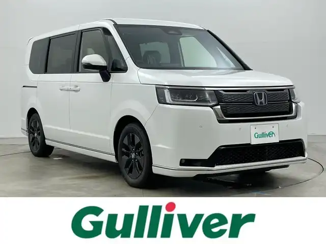 ホンダ ステップワゴン スパーダ eHEV 岡山県 2025(令7)年 0.1千km プラチナホワイトパール 登録済未使用車/純正11.4インチナビ/・FM/AM/Bluetooth/フルセグ/CD/DVD/CarPlay/15.6インチ後席モニター/ハーフレザーシート/・シートヒーター/パワーバックドア/ホンダセンシング/・衝突軽減ブレーキ/・車線逸脱警報/車線維持支援システム/・アダプティブクルーズコントロール/・コーナーセンサー/両側パワースライドドア/2列目オットマン/パドルシフト/オートブレーキホールド/ダブルエアコン/純正16インチアルミ