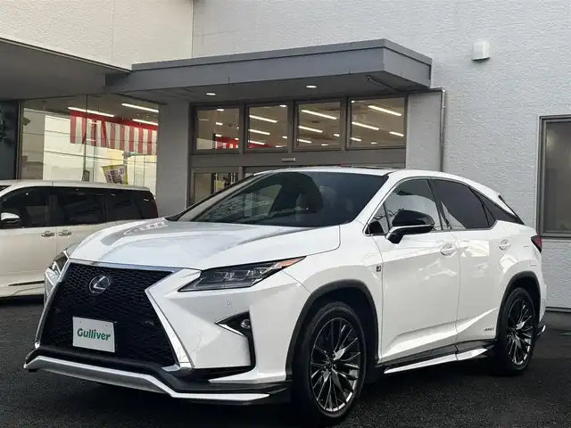 レクサス ＲＸ 450h Fスポーツ 熊本県 2018(平30)年 8.6万km ホワイトノーヴァガラスフレーク サンルーフ/純正ナビ/【フルセグTV/CD/DVD/Bluetooth】/パノラミックビューモニター/バックカメラ/レーダークルーズコントロール/衝突被害軽減ブレーキ/レーンキープアシスト/ヘッドアップディスプレイ/コーナーセンサー/赤革シート/パワーシート/シートヒーター/エアシート/純正20インチAW/置くだけ充電/電動パーキング/ビルトインETC2.0/オートLEDヘッドライト/ウィンカーミラー/プッシュスタート/ステアリングスイッチ/純正フロアマット/横滑り防止/盗難防止装置/取扱説明書
