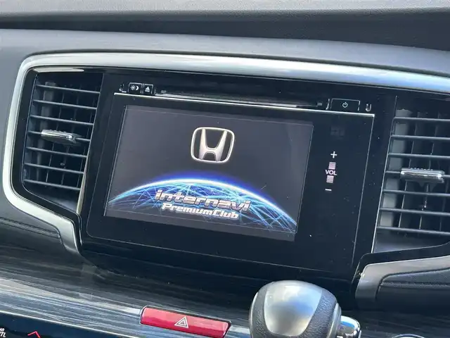 ホンダ オデッセイ ハイブリッド アブソルートセンシングEXパック 静岡県 2016(平28)年 7.4万km ホワイトオーキッドパール ホンダセンシング/1.衝突軽減ブレーキ/2.誤発進抑制機能/3.歩行者事故低減ステアリング/4.路外逸脱抑制機能/5.アダプティブクルーズコントロール/6.車線維持支援システム/7.先行車発進お知らせ機能/8.標識認識機能/9.後方誤発進抑制機能/10.近距離衝軽減ブレーキ/11.オートハイビーム/12.アダプティブドライビングビーム（車速可変照明角度）/13トラフィックジャムアシスト（渋滞運転支援機能）/純正8インチナビ/FM/AM/CD/DVD/Bluetooth/iPod/レーダークルーズコントロール/フリップダウンモニター/両側パワースライドドア/全周囲カメラ/ビルトインETC/前後ドラレコ/ハーフレザーシート/オットマン/ウォークスルー/オートライト