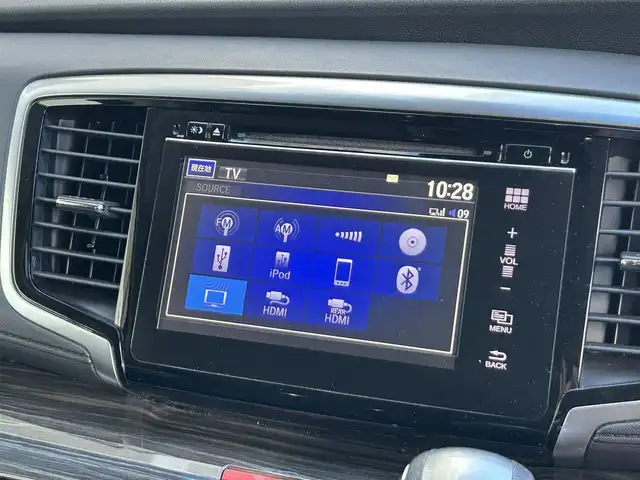 ホンダ オデッセイ ハイブリッド アブソルートセンシングEXパック 静岡県 2016(平28)年 7.4万km ホワイトオーキッドパール ホンダセンシング/1.衝突軽減ブレーキ/2.誤発進抑制機能/3.歩行者事故低減ステアリング/4.路外逸脱抑制機能/5.アダプティブクルーズコントロール/6.車線維持支援システム/7.先行車発進お知らせ機能/8.標識認識機能/9.後方誤発進抑制機能/10.近距離衝軽減ブレーキ/11.オートハイビーム/12.アダプティブドライビングビーム（車速可変照明角度）/13トラフィックジャムアシスト（渋滞運転支援機能）/純正8インチナビ/FM/AM/CD/DVD/Bluetooth/iPod/レーダークルーズコントロール/フリップダウンモニター/両側パワースライドドア/全周囲カメラ/ビルトインETC/前後ドラレコ/ハーフレザーシート/オットマン/ウォークスルー/オートライト